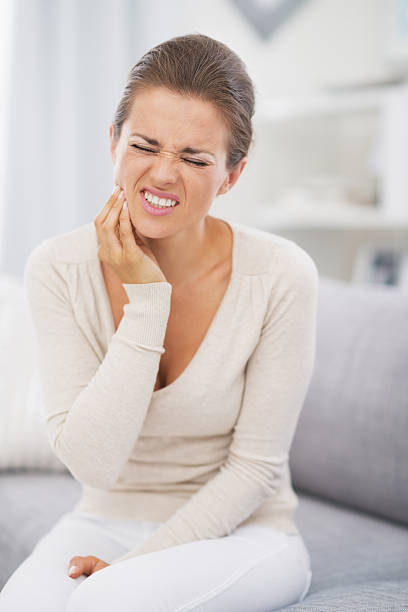 istock young woman having toothache 480071647