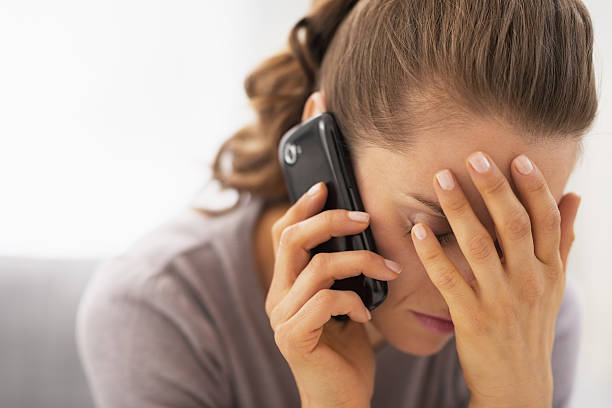 istock stressed young woman talking mobile phone 480071879