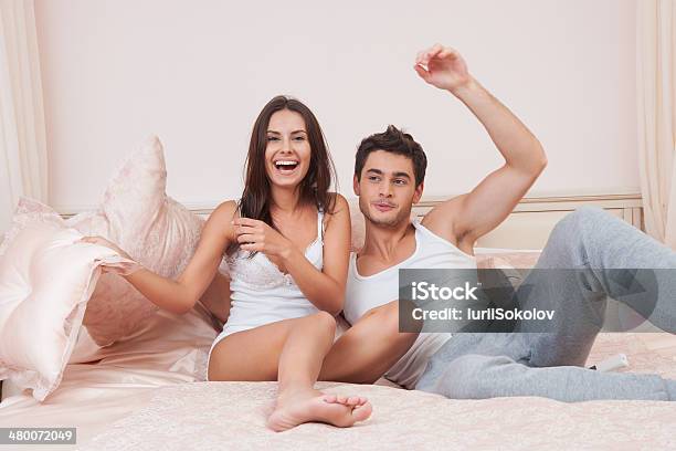 Happy Couple In Bedroom Stock Photo - Download Image Now - Activity, Adult, Adults Only