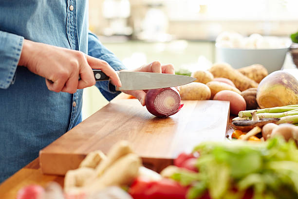 istock Midsection image of woman chopping onion 480072498