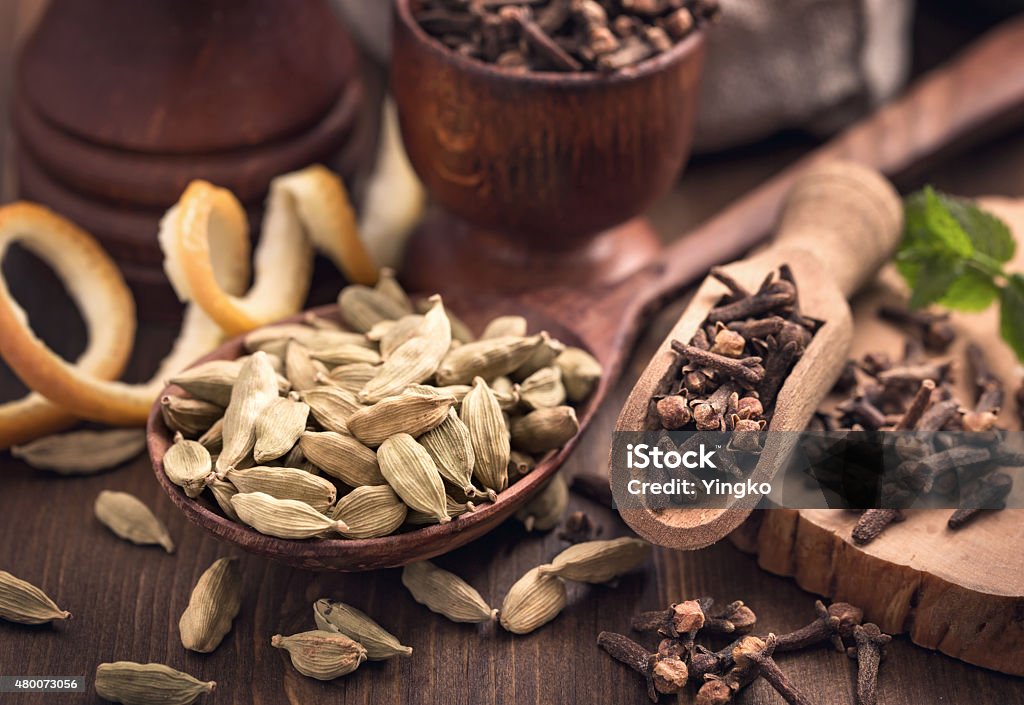 Clove and cardamom spices still-life Clove and cardamom spices still-life. Seasoning for beverages preparation. 2015 Stock Photo