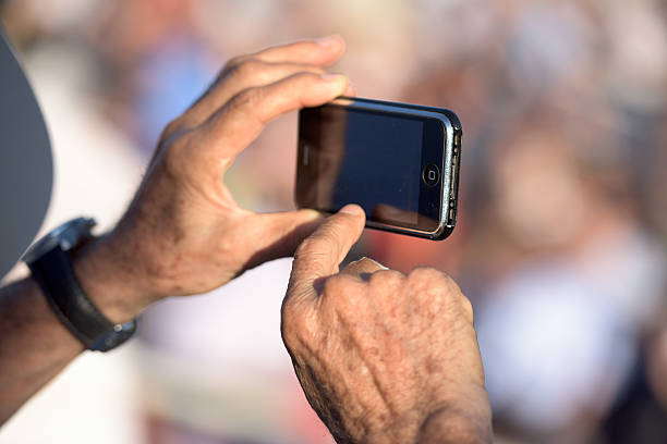 istock hands photographing with cellular phone 480076284