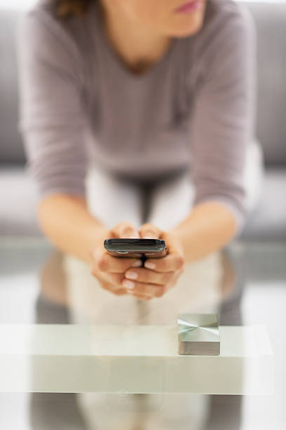 istock closeup on young woman writing sms 480082301