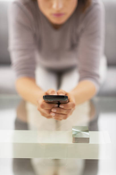 istock closeup on young woman writing sms 480082327