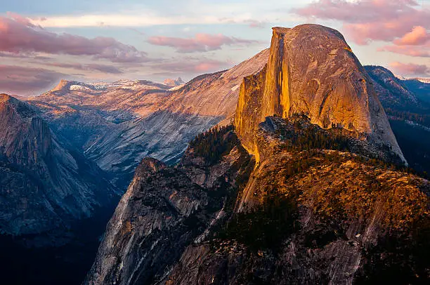 A brilliant sunset view of Half Dome from Glacier Point, a location that is only accessible via a strenuous hike, much of the year. Glacier Point give one of the best views of the Valley and several waterfalls including Vernal Falls, Nevada Falls, and Yosemite Falls.