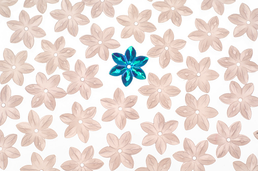 Little shiny buttons for sewing and stitching in the form of flowers. Isolated on white.