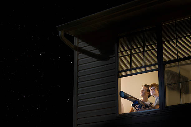 istock Boys With Telescope Looking At Night Sky 480089259