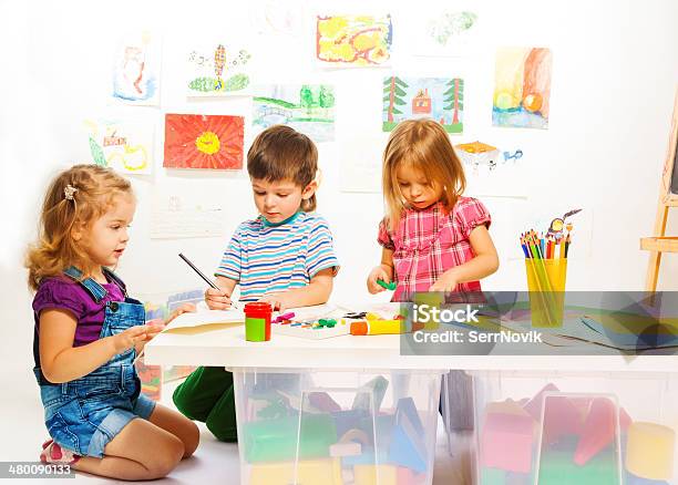 Three Creative Kids Stock Photo - Download Image Now - Child, Craft, Table