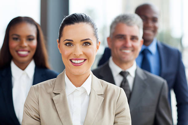istock businesswoman with co-workers 480091295