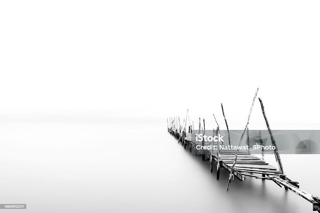 Lonely wooden bridge black and white Bay of Water Stock Photo