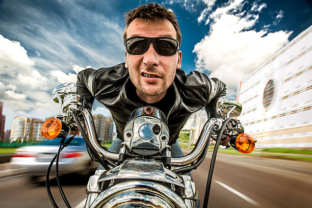 istock Funny Biker racing on the road 480093763