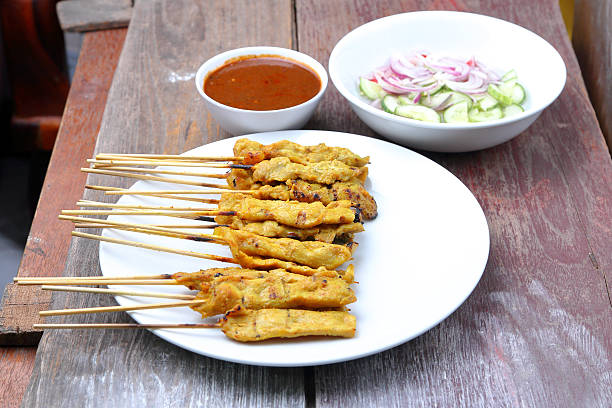 istock Pork Satay with Peanut Sauce, Wood table background. 480096744