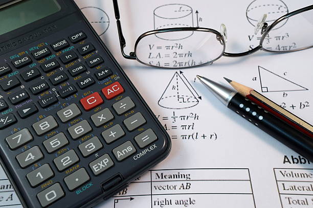 istock Eye Glasses, pen and pencil over the Formula with calculator 480098096