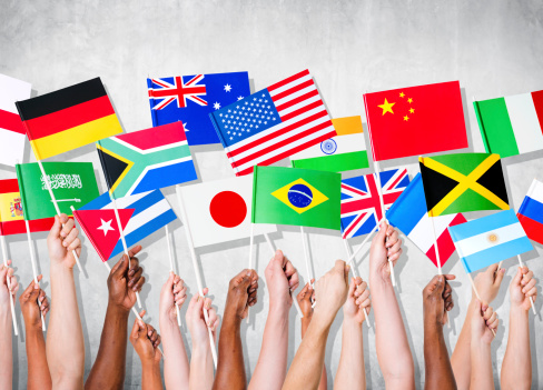 Human Hands Holding National Flags photo