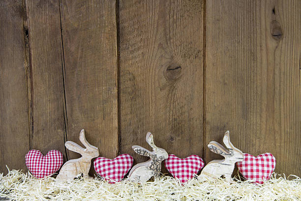 istock Red checked hearts on wooden background for easter. 480099179
