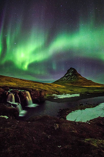 Aurora borealis at Mount Kirkjufell Iceland Aurora borealis at Mount Kirkjufell Iceland kirkjufell stock pictures, royalty-free photos & images