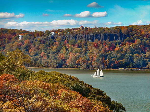 Hudson River Palisades and Sailboat in Autumn Hudson River Palisades and Sailboat in Autumn hudson river photos stock pictures, royalty-free photos & images