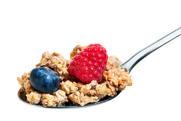 istock Macro close up of spoon with fruit muesli. 480107778