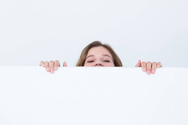 istock Woman looking top of poster 480107806