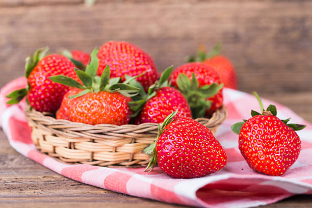 istock fresh strawberries in a bowl with checkered napkin 480108058