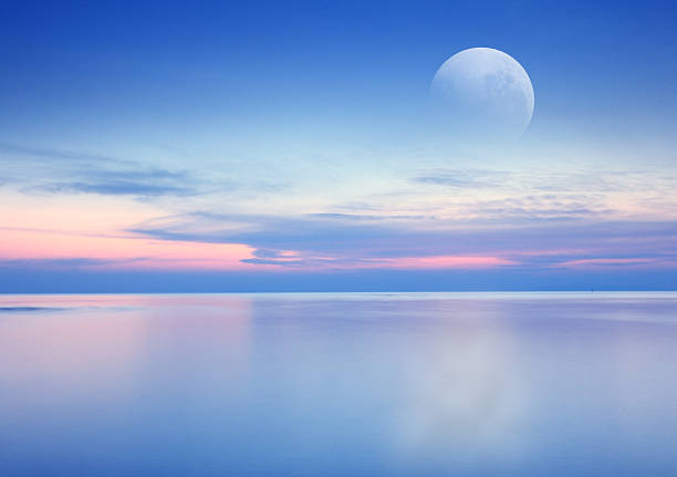 istock Beach sunrise with dramatic sky, sea and moon background 480110037