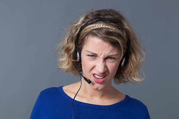 istock irritated young callcenter assistant frustrated by difficult phone calls 480111034