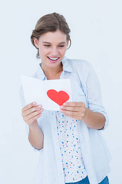 istock Smiling woman reading love letter 480112170