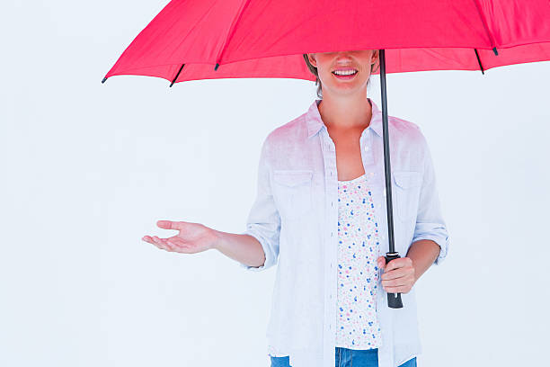 istock Woman holding an umbrella 480112196