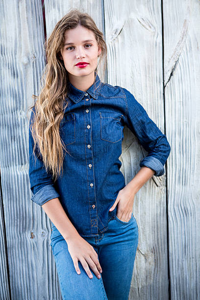 istock Pretty woman looking at camera with hands in pockets 480112308