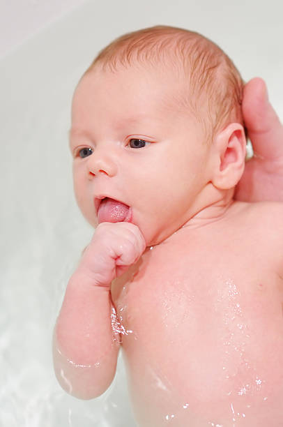 istock Newborn baby in bath 480113907