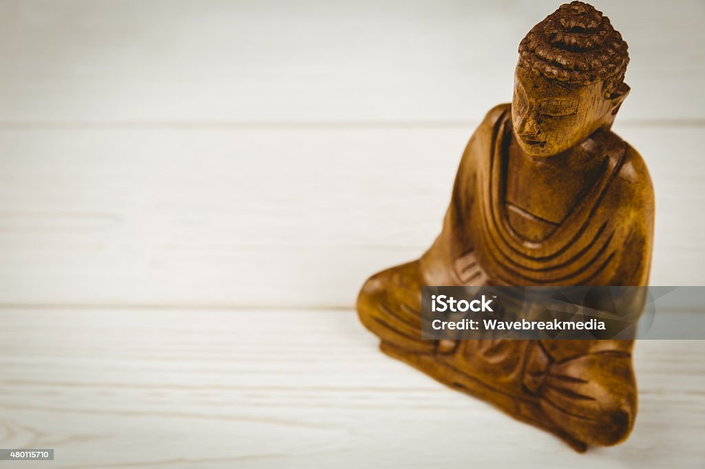 Buddha statue on a table Buddha statue on a table shot in studio 2015 Stock Photo