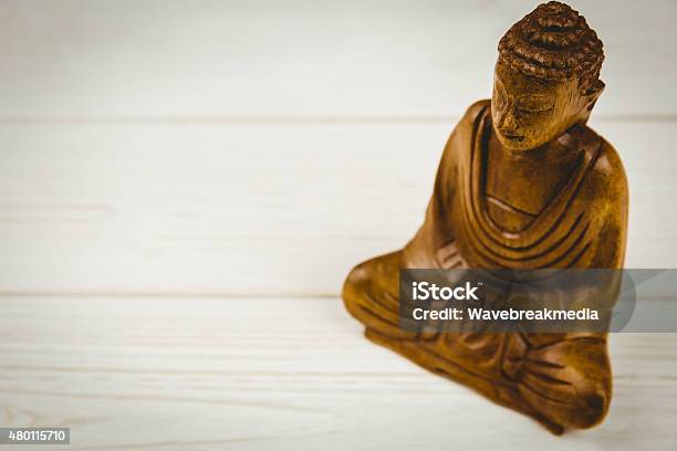Buddha Statue On A Table Stock Photo - Download Image Now - 2015, Buddhism, Figurine