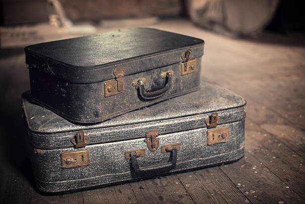 istock Old vintage suitcases in a dusty attic 480118166