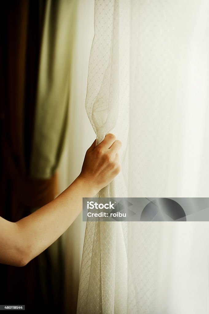 Curtain Hand Hand Pulling A Window Curtain Stock Photo - Download Image Now ...