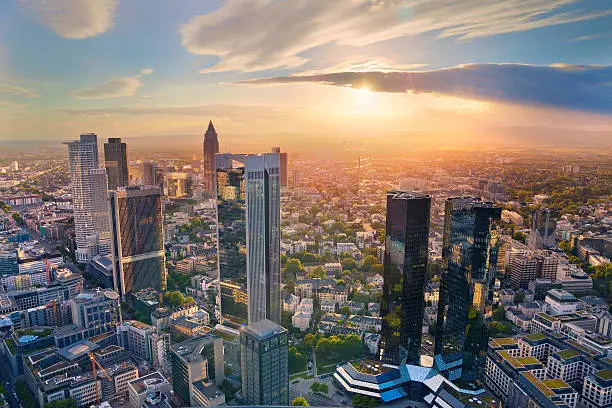 Aerial view of Frankfurt am Main skyline during golden hour.
