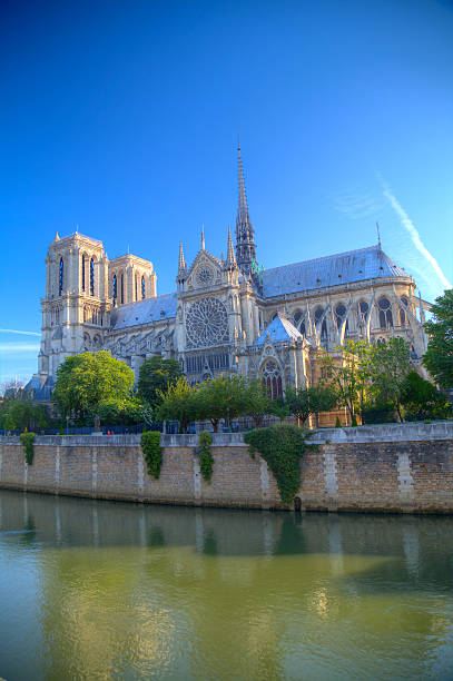 istock Gorgeous sunset over Notre Dame cathedral with puffy clouds, Par 480121888