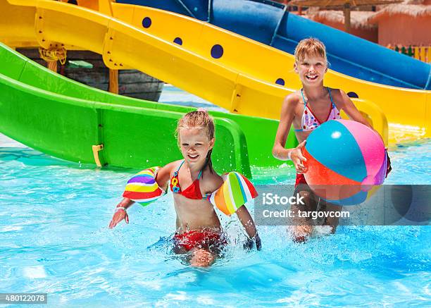 Child On Water Slide At Aquapark Stock Photo - Download Image Now - Water Park, 2015, Activity