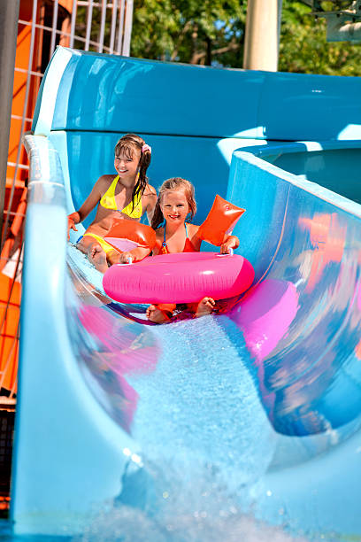 istock Child on water slide at aquapark 480125282