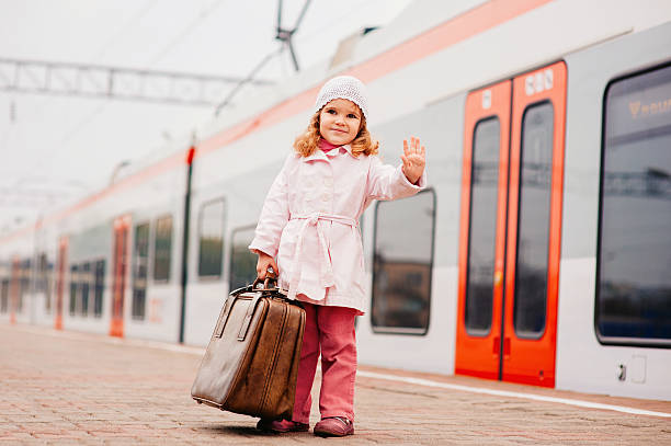 istock Little girl waiting for a train 480125953