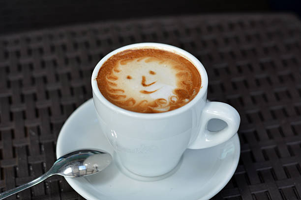 istock Cup Of Foamy Cappuccino With Smile On A Black Background 480129318