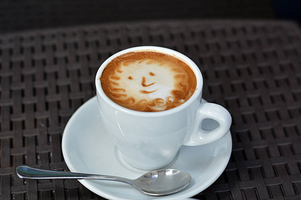 istock Cup Of Foamy Cappuccino With Smile On A Black Background 480129320