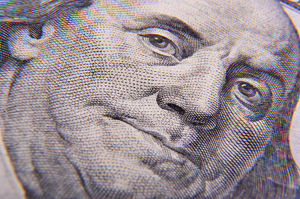 istock Benjamin Franklin's face on the one hundred dollars 480129619