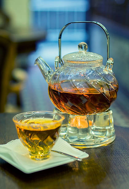 istock Glass teapot and cup with tea 480130392