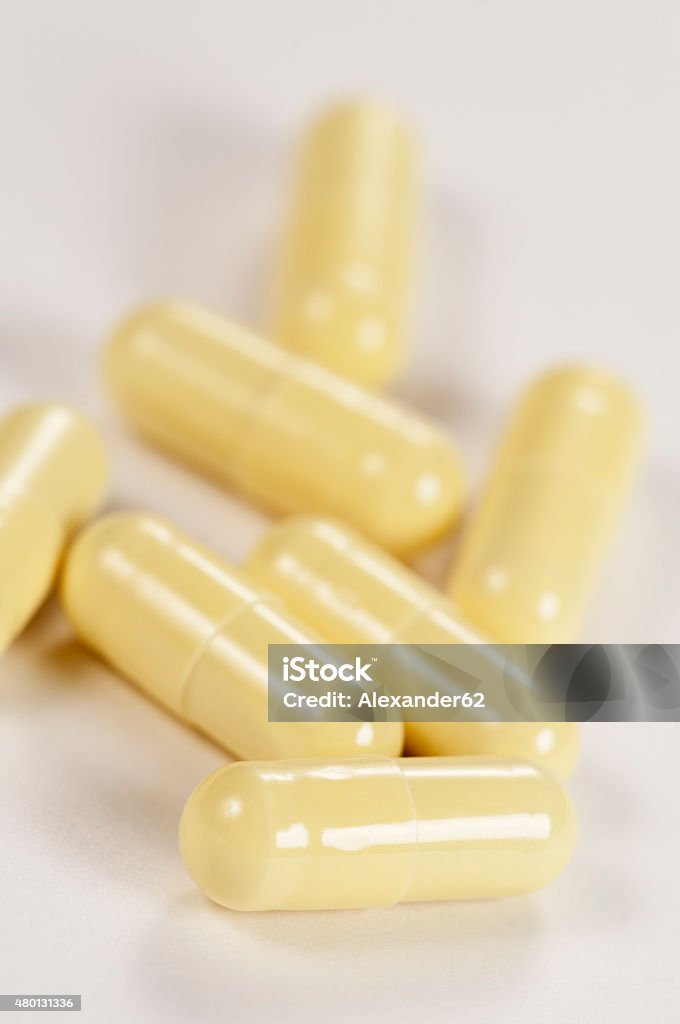 Capsules Capsules of antibiotic over light background, macro shot 2015 Stock Photo