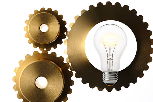 istock Isolated shot of light bulb with gears on white background 480132374