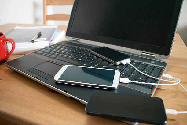 istock Smartphones charged by a laptop 480133276