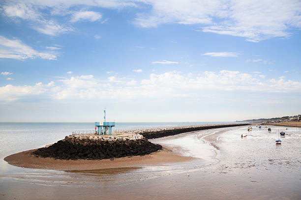 tide out breakwater in Herne Bay Kent England summer evening