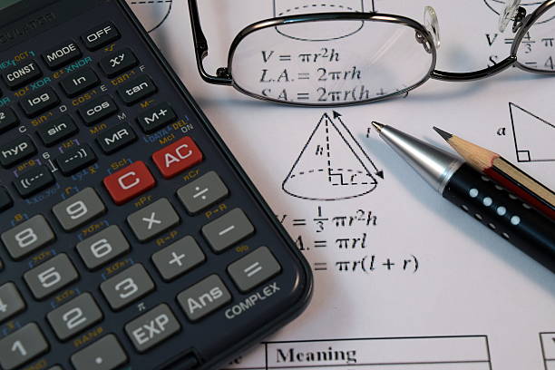istock Eye Glasses, pen and pencil over the Formula with calculator 480136954