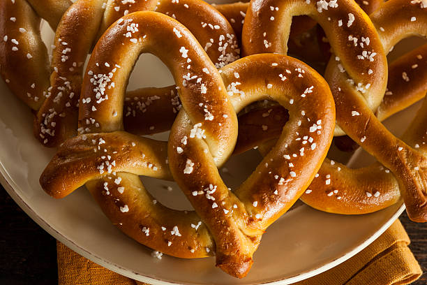 Homemade Soft Pretzels with Salt Homemade Soft Pretzels with Salt Ready to Eat chewy photos stock pictures, royalty-free photos & images