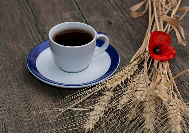 mug of black coffee wheaten colossuses and flower